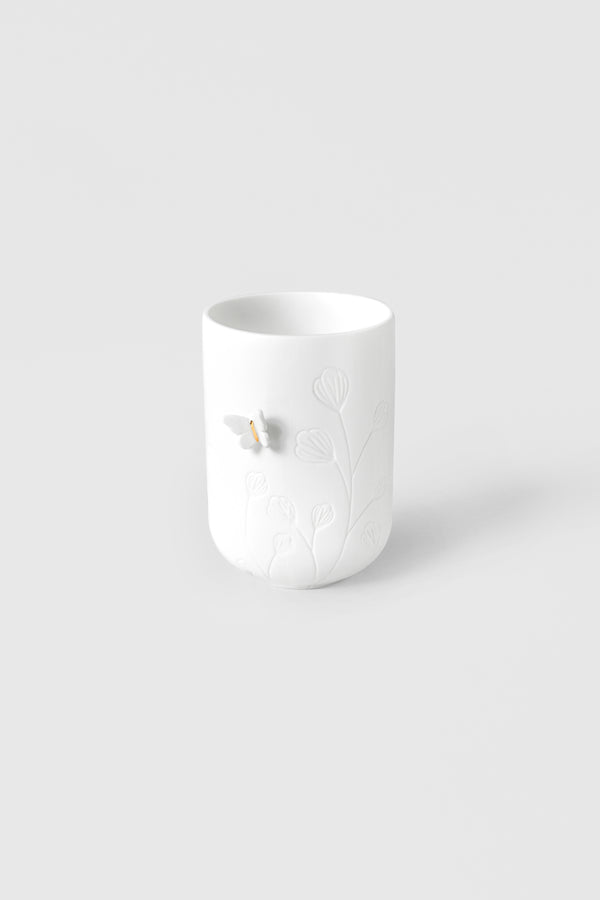 Photophore en porcelaine blanche motif floraux et papillon en relief sur le côté 4avril